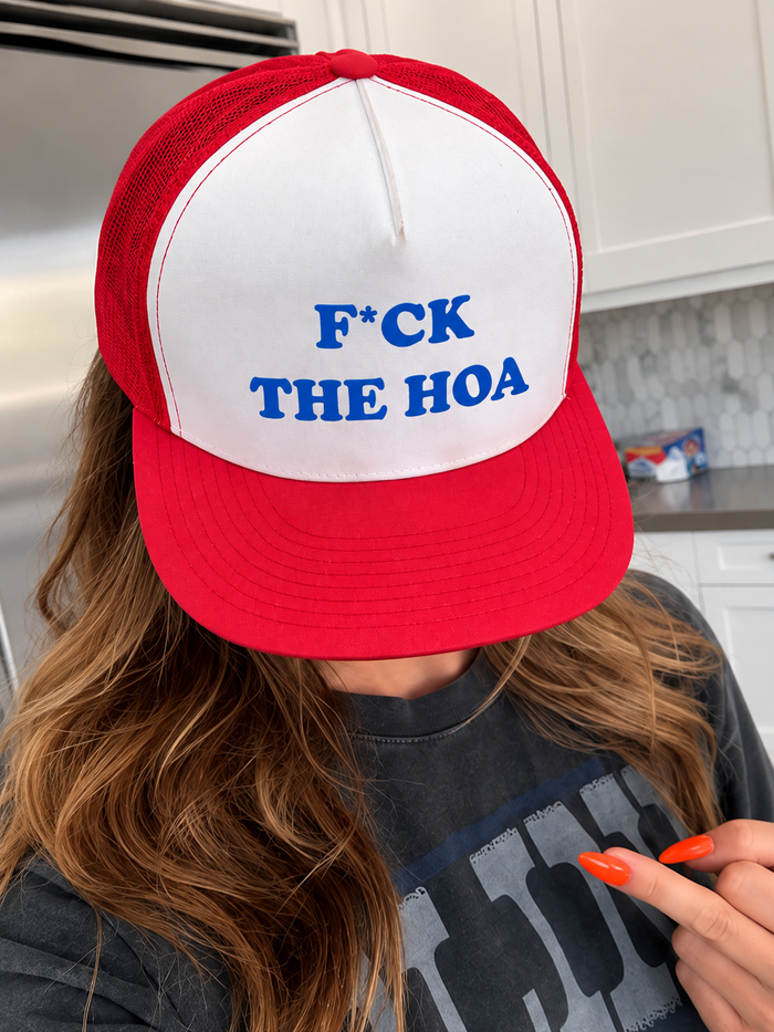 Customer showing the printed logo on a red F*ck the HOA hat