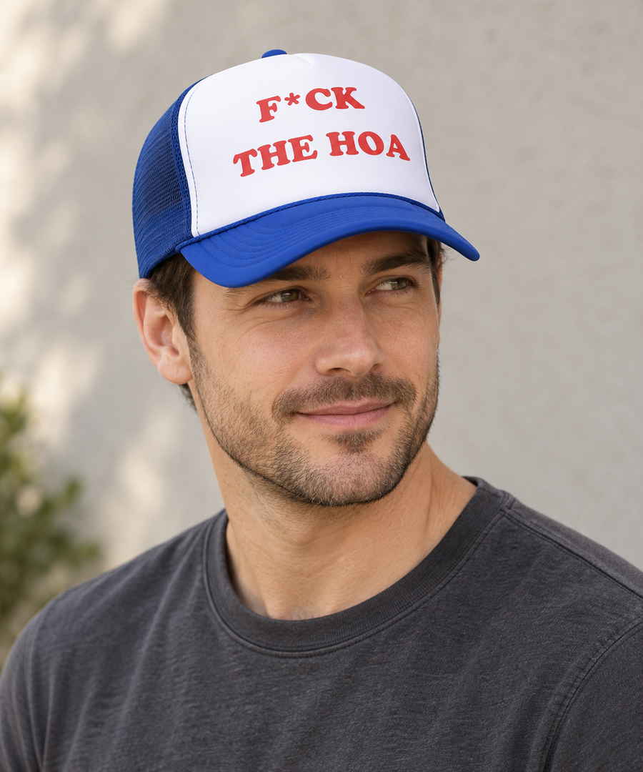 Man wearing the blue F*CK THE HOA foam trucker with curved bill